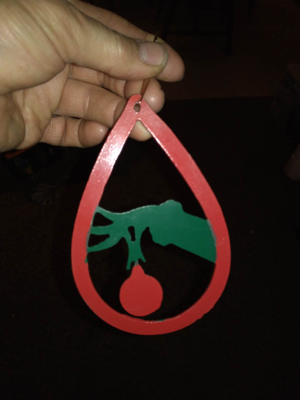 Blue Star Fabrication - Christmas Cutoutsgrinch holding ball ornament painted